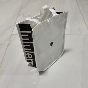 FREE White and black Lululemon bag size small with snap closure.